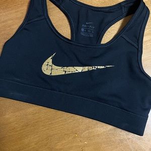 Nike black with gold swoosh!! Xtra Small ! Sports bra!